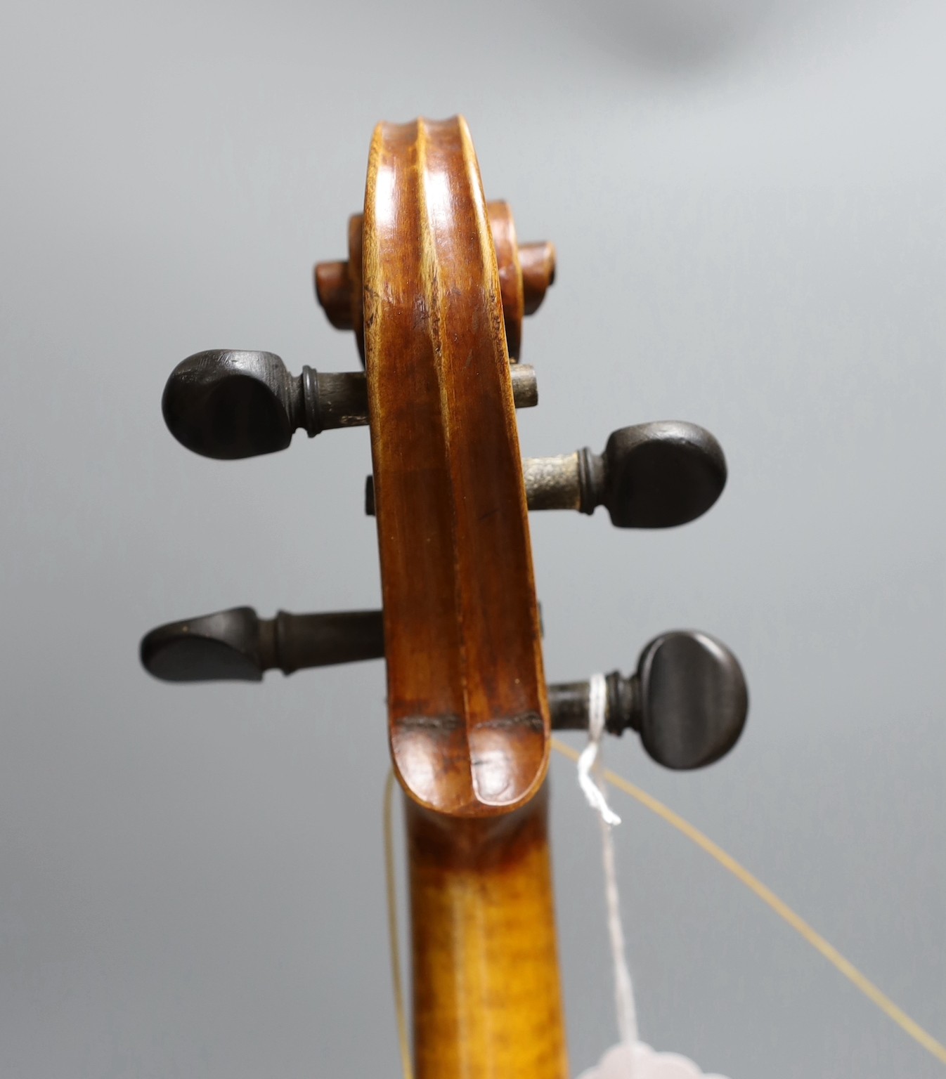 A cased 19th century violin, labelled Stradivarius 1690, with a Dodd bow
